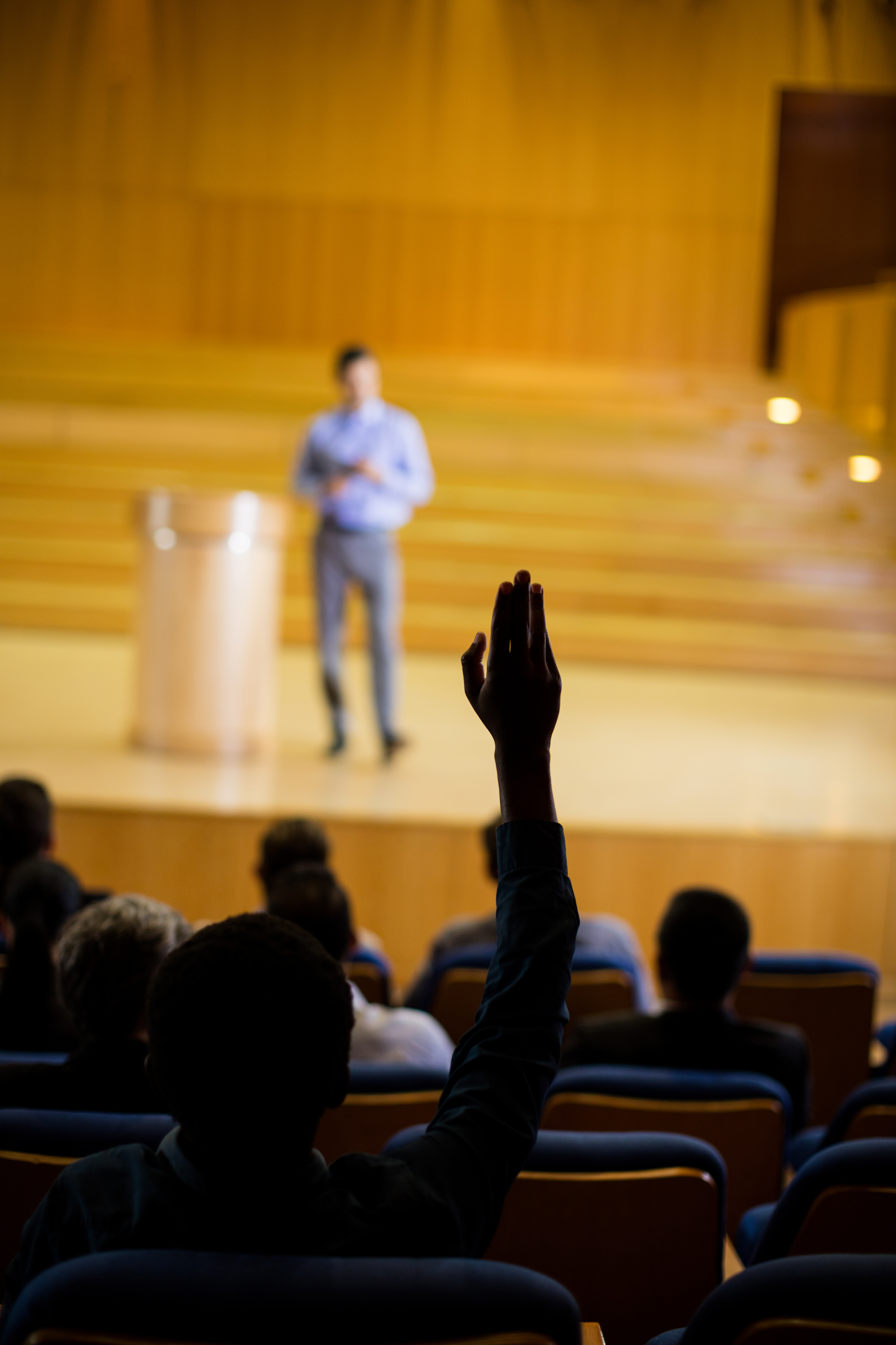 Male business executive giving a speech at conference center Male business executive giving a speech at conference center